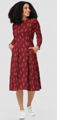 The Conviction Long-sleeve modest midi dress with functional pockets, modern geometric print, faith-inspired women’s fashion by Tela Designs Store. Modeled by light skinned African American woman with natural hair out and down shoulder length. She models t